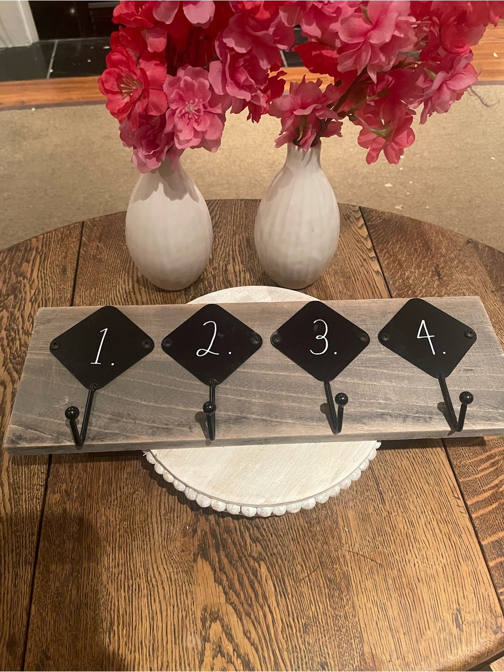 Rae Dunn Black Numbered Hook Rack on Gray Wood